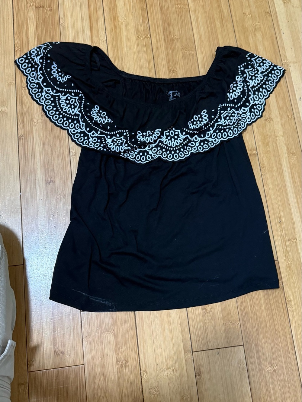 Black Off-Shoulder Blouse with White Embroidered Ruffle